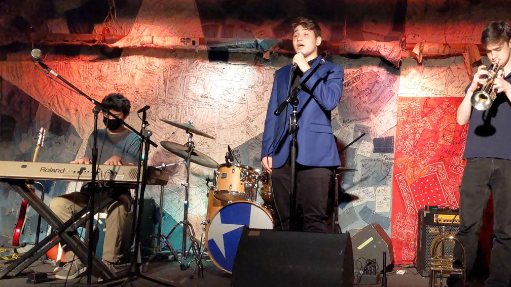Max Borak performs with other students