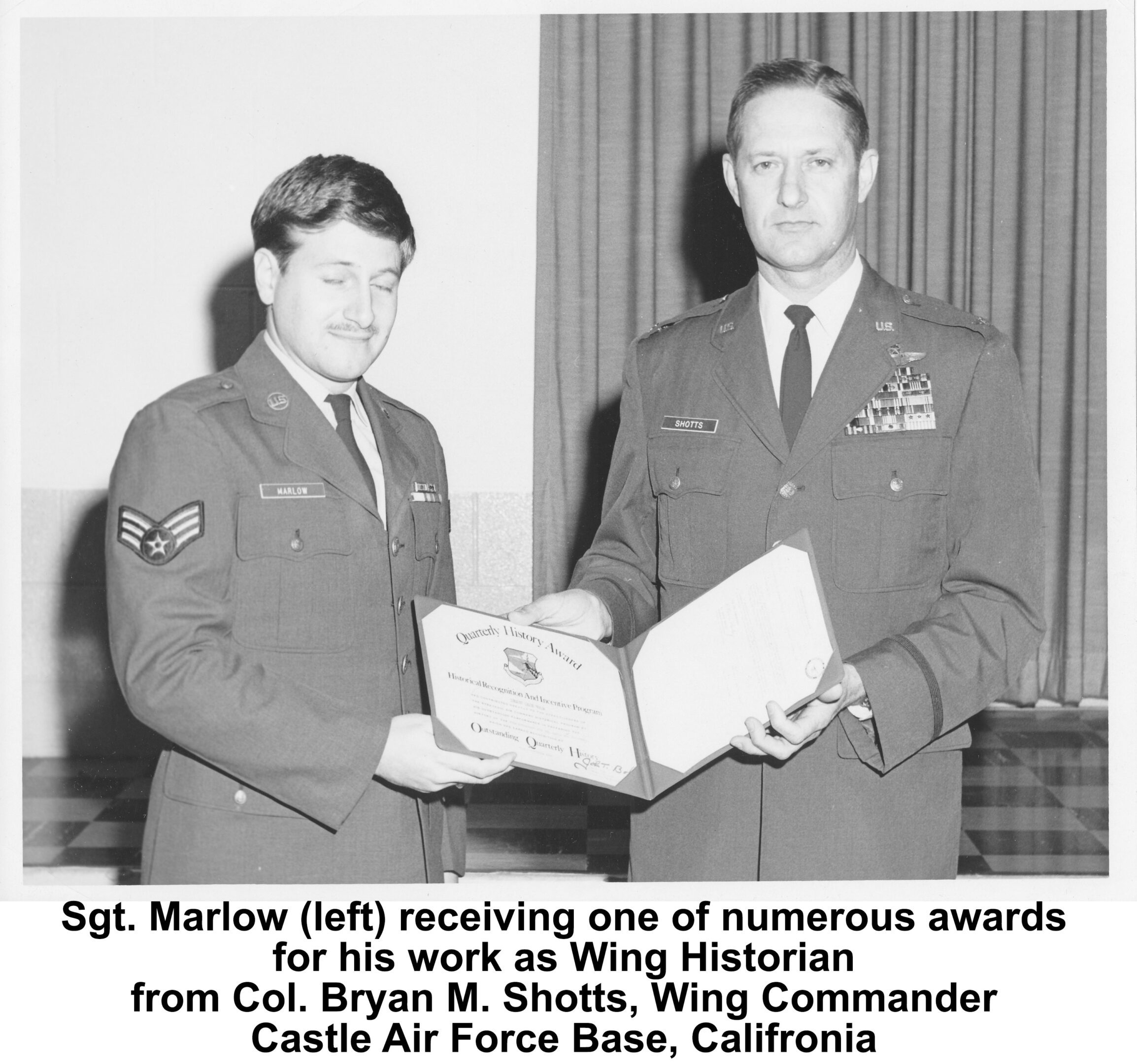 Sgt. Marlow receives one of numberous award for his work as Wing Historian from Col. Bryan M. Shotts, Wing Commander Castle Air Force Base, California