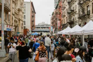 People of all backgrounds enjoying the Egg Rolls, Egg Creams & Empanadas Street Fair
